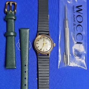 Ladies Gold Tone Watch With Black Rubber Strap And Green Leather Strap With Tool